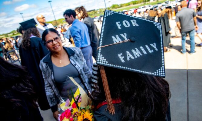 Graduation cap reads "for my family" at Newman University commencement, 2022