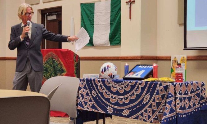 Men's Soccer Coach Cliff Brown describes the significance of items on a table commemorating the late 21-year-old Austin Madubuike during a celebration of life service held on Nov. 3.