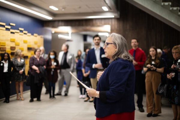 President Kathleen Jagger speaks to attendees of the open house event.