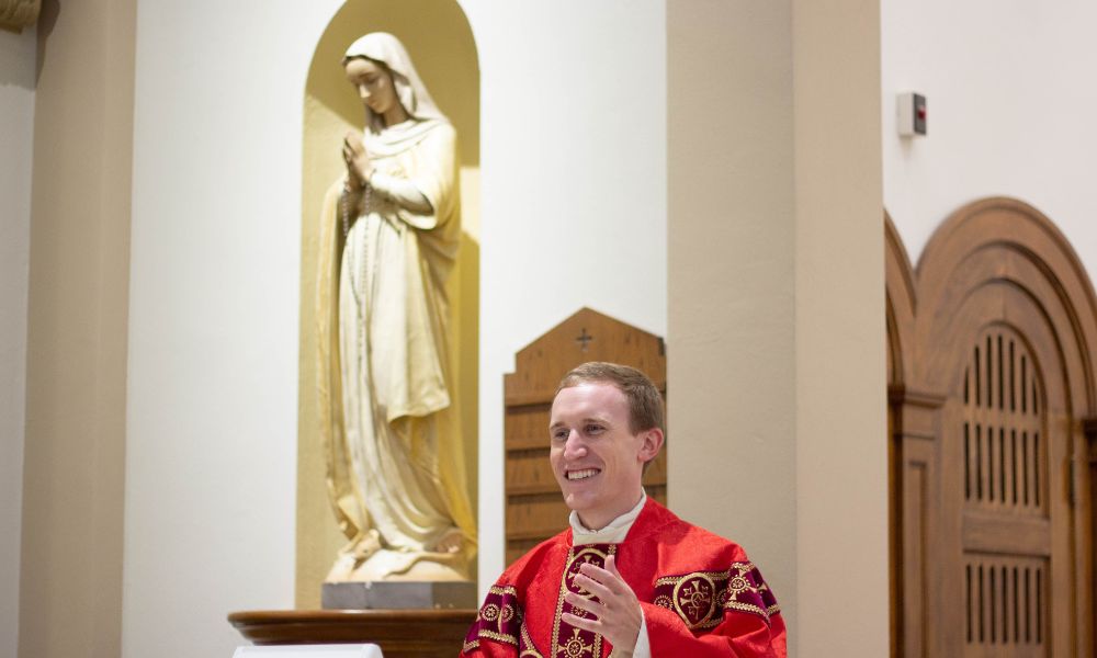 Father Adam Grelinger offers Mass in St. John's Chapel.