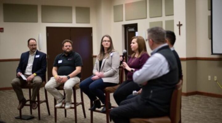 Panelists answer questions about problem solving and data solutions in the field during the first Data Professionals of Wichita event in March 2022.