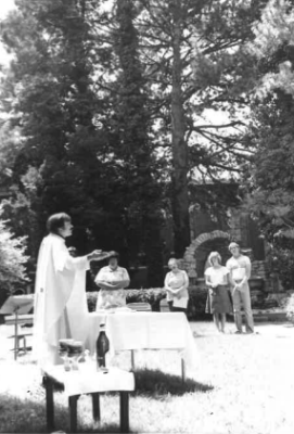 Father Tom Welk offers Mass near the Marian Grotto outside of Sacred Heart Hall in the 70s.
