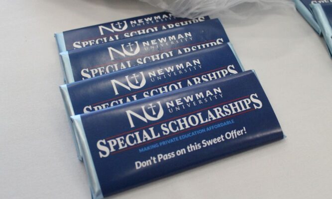 Candy bars at the refreshments table are labeled with "Special Scholarships, you don't want to miss this sweet offer!"