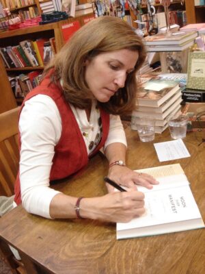 Vanderpool signs copies of her book, "Moon Over Manifest" at Watermark Books in Wichita. (Courtesy photo)