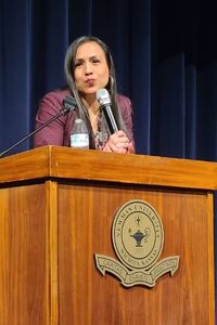 Gina Garcia presents "Becoming a Hispanic-serving institution" to a full crowd in the De Mattias Performance Hall Feb. 9. 