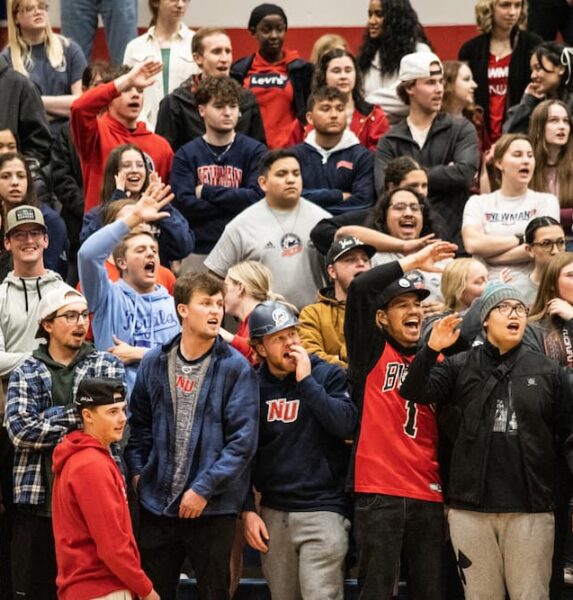 the student section during a Homecoming game at Newman University