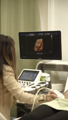 Siyavong conducts an ultrasound at Glimpse of Love. (Courtesy photo)