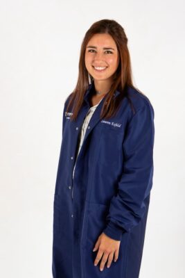 Lauren Esfeld in her Newman University lab coat.