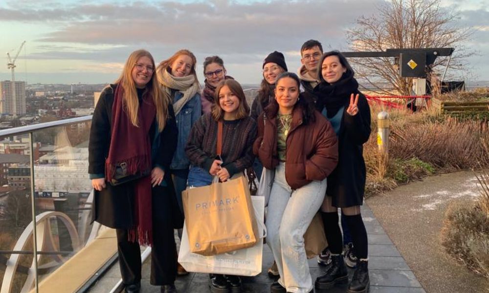 Emily Pachta (front and center) and fellow exchange students atop the Birmingham Public Library. (Courtesy photo)