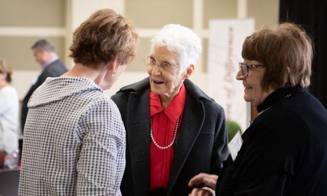 Joan Felts, former dean of the Newman School of Nursing and Allied Health, mingles with fellow donors during the scholarship luncheon March 27.