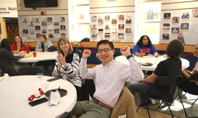 Professors Janet Jump and Huachuan Wen cheer on students during 2023 Giving Day.