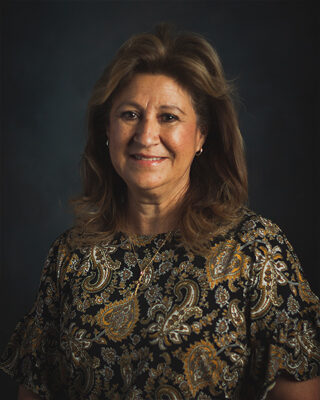 Yolanda Camarena, emeritus board member for KHEDF and Newman Board of Trustees member