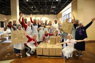 Newman University students, faculty and staff packaged 22,000 bags of rice for the hungry in Haiti.