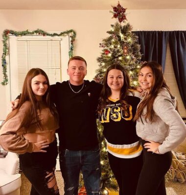 Kylie Lucent (second from the right) smiles with her younger siblings on Christmas. (Courtesy photo)