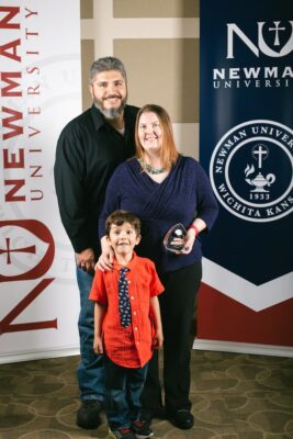 Lisa Garcia received the 2023 Spirit of Acuto Alumni Award. Garcia is pictured with her husband and son.