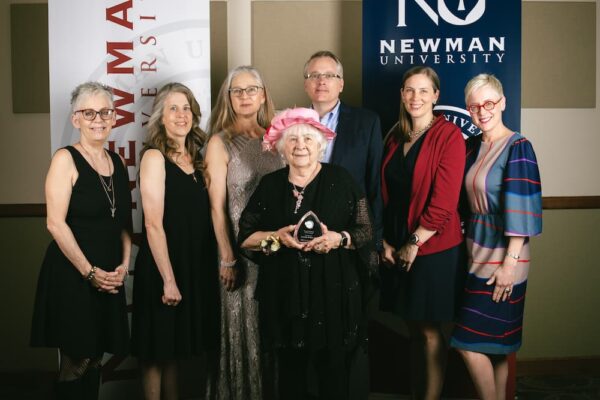 Lovella Kelley (front, center) received the 2023 Beata Netemeyer Alumni Award. Kelley is pictured with all six of her children.