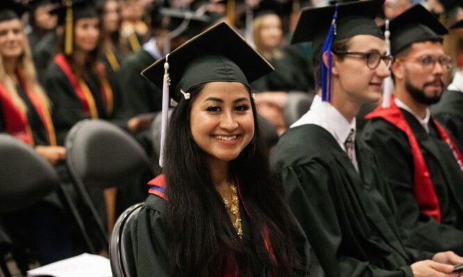 Mai Dao smiles on Newman commencement day.