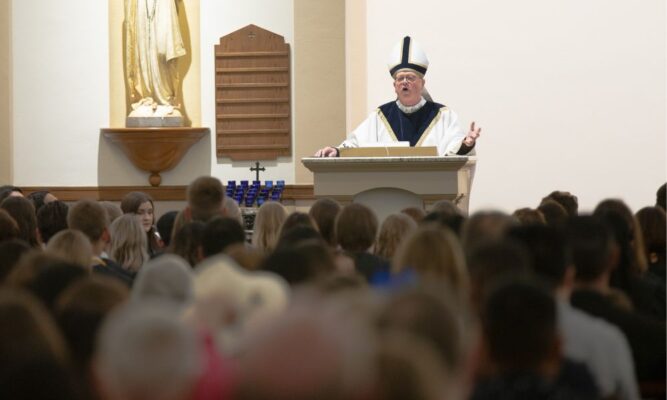 Bishop Kemme shares a heartfelt homily in St. John's Chapel at Newman University.