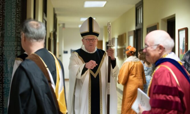 Bishop Carl Kemme greets guests following the Baccalaureate Mass May 11.