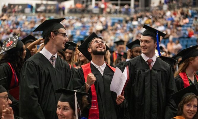 Graduates celebrate their tremendous achievement at Newman University commencement.