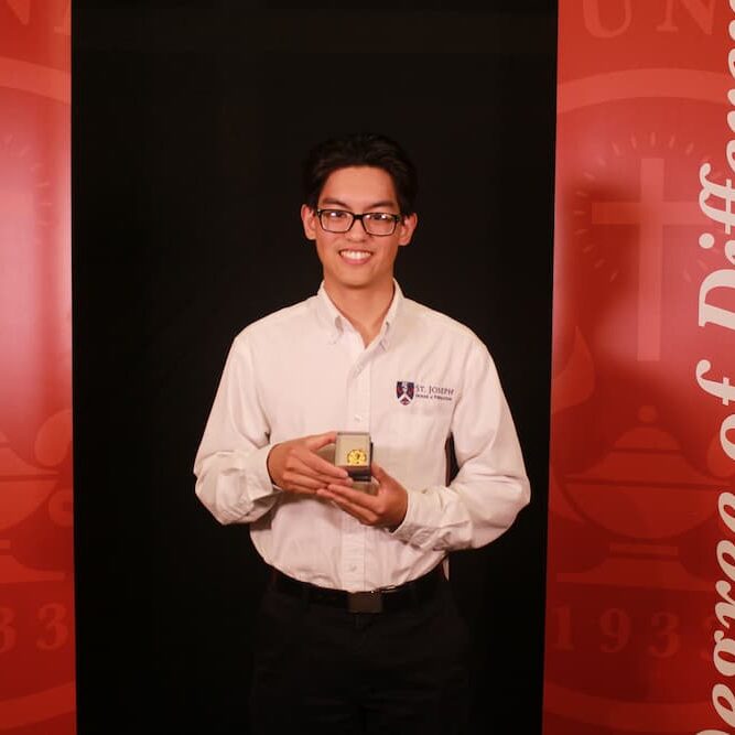 While a seminarian of St. Joseph's House of Formation, Nguyen received the St. Catherine's Medal at Newman University.