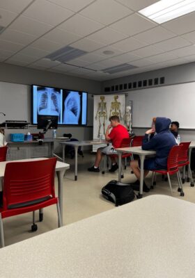 Students learn about the field of radiologic technology in a Newman University classroom.