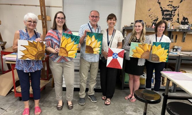 Alumni participated in a DIY canvas painting event. Courtney Klaus is pictured second from the right.