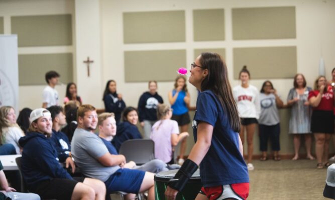 Students, Newman faculty and staff played games during breakfast Friday morning in the Dugan-Gorges Conference Center.