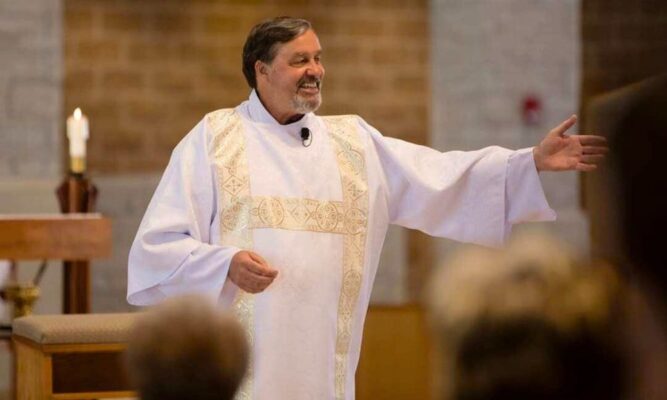 Deacon Jeff Jacobs preaches during a Mass at Church of the Magdalen.