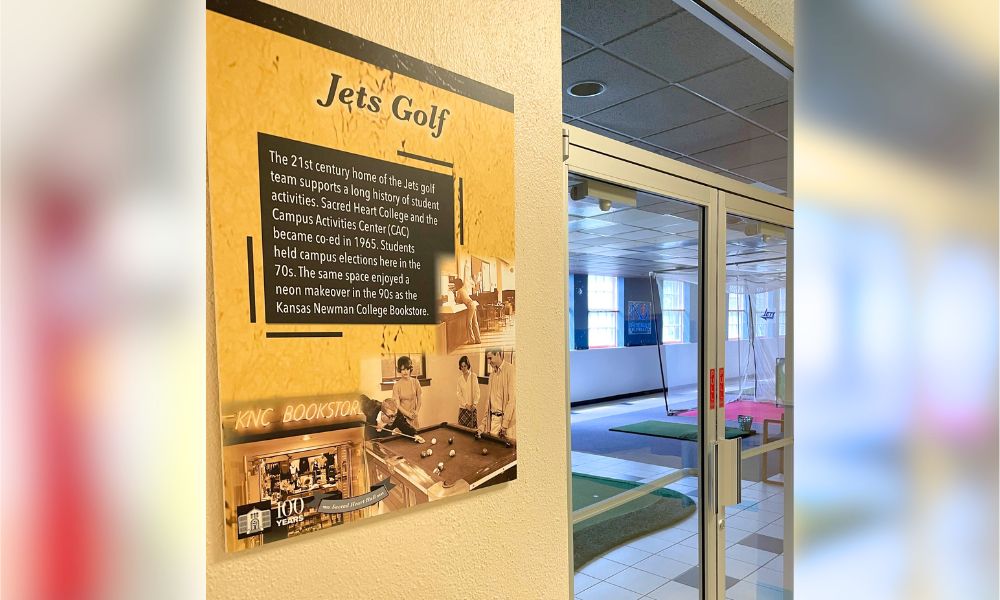 A "Jets Golf" historical marker shares that the space currently used for golf practices was once the bustling Campus Activities Center.