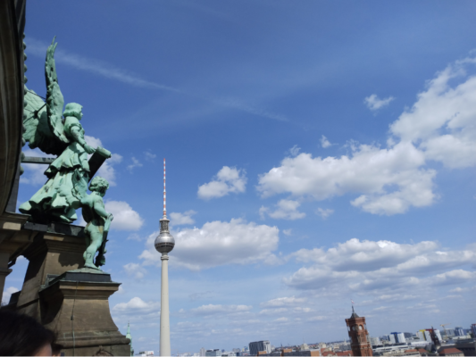 We climbed hundreds of stairs to the top of the Protestant Berlin Cathedral, and this is a view from the top, with some of the statues on the dome on the left. You can see the Berlin Needle and the clock tower of the Town Hall in the background.