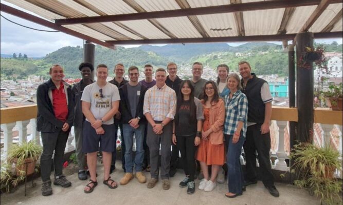 The group gathers for a photo after a day of service in Guatemala.