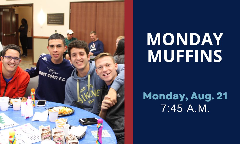 Students gather at a table for Monday Muffins