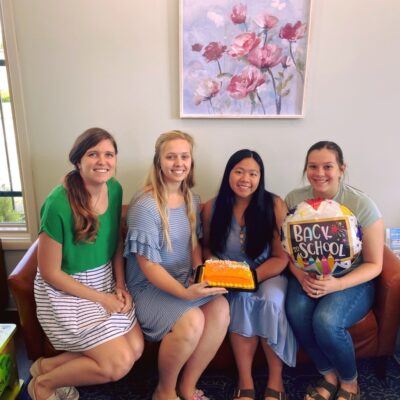 Director of Volunteer Resources Madison Ellis (middle, left) and volunteers of A Better Choice celebrate Sydney Le (middle, right) at the conclusion of her summer internship.