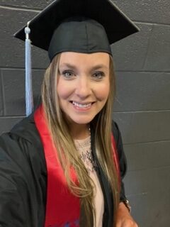 Jana Phillips wears her cap and gown on Newman University commencement day. (Courtesy photo)