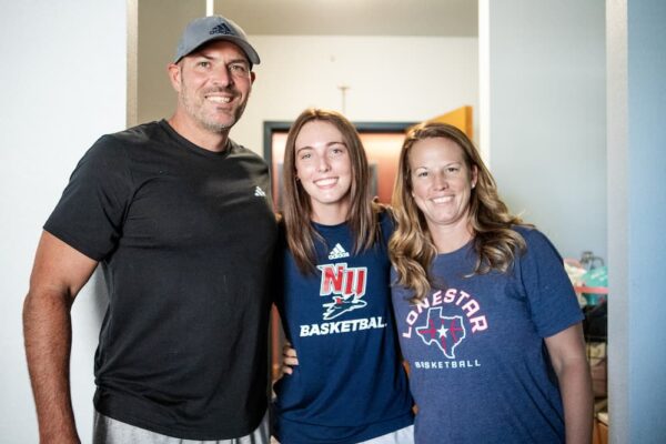 Jaeden McMillin (center) and family members get settled in during move in day.