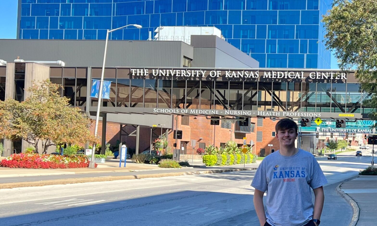 Joshua Dessenberger stands outside of The University of Kansas School of Medicine.