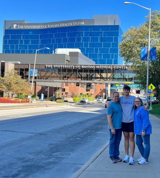 Dessenberger and family stand outside of The University of Kansas School of Medicine.