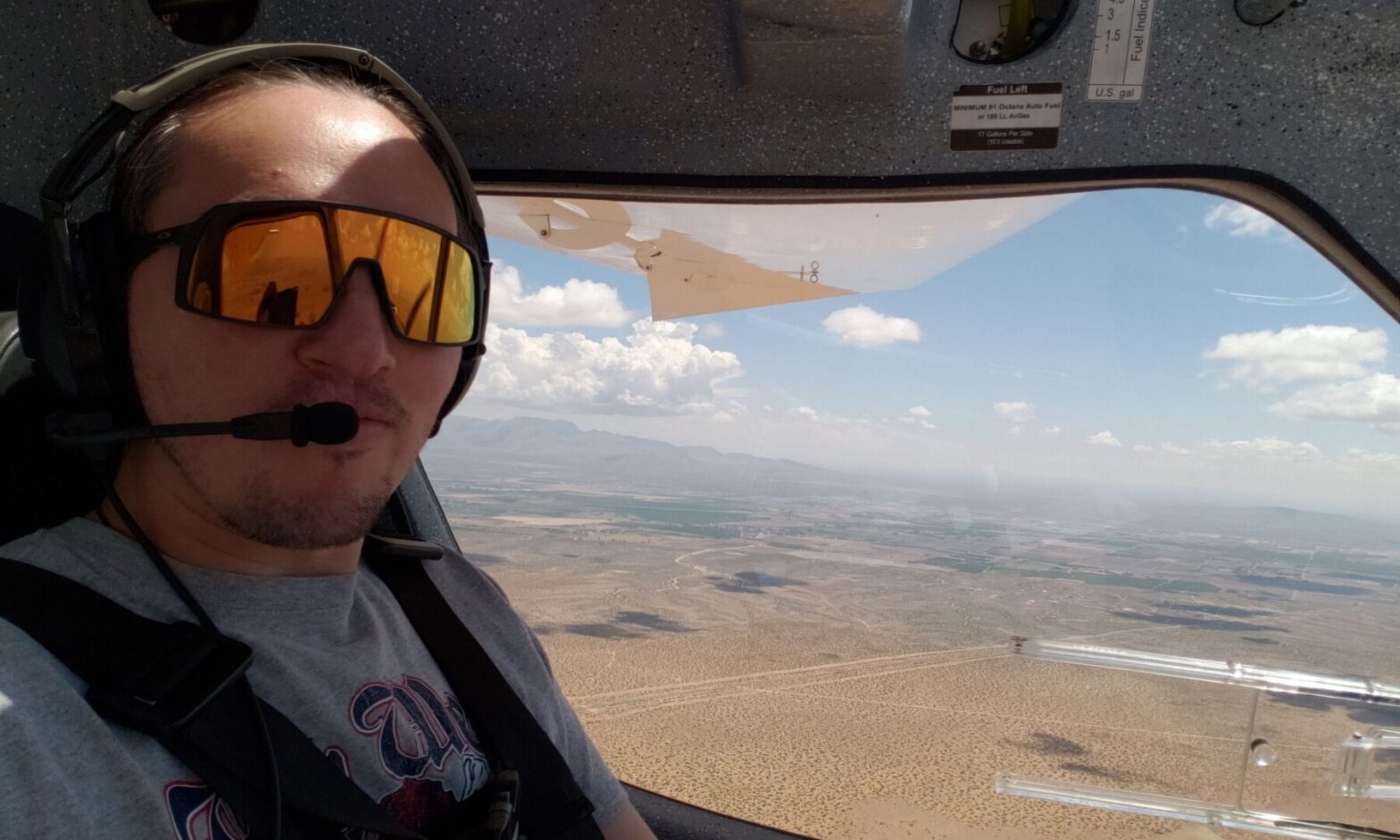Thomas Watson wears his pilot gear as he flies a plane.