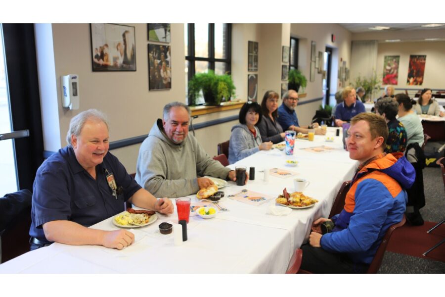 Staff and faculty gather over a hot breakfast in Mabee.