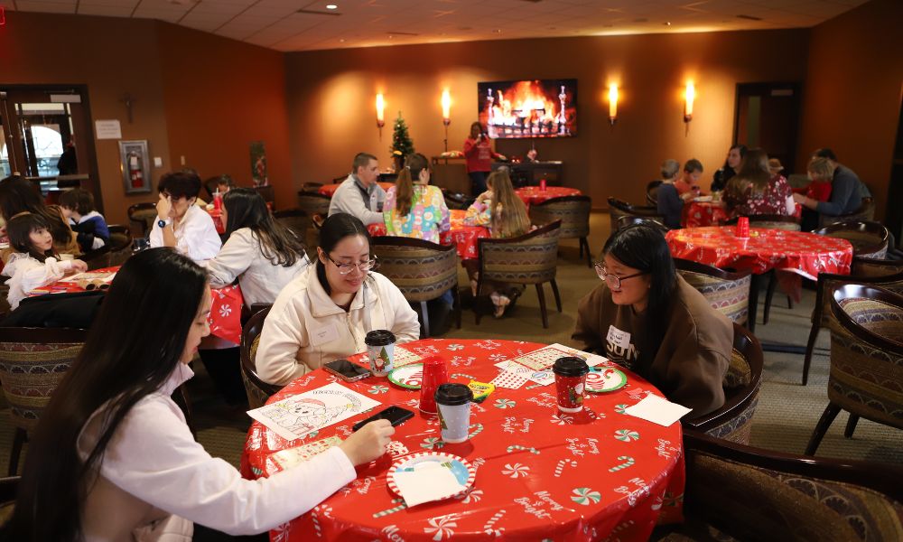 As Christmas music played in the background, alumni played games, enjoyed cookies, hot cocoa and coloring sheets.