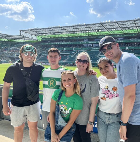 Students of the 2023 Europe by Rail trip watch a Rapid Vienna soccer game in Austria.