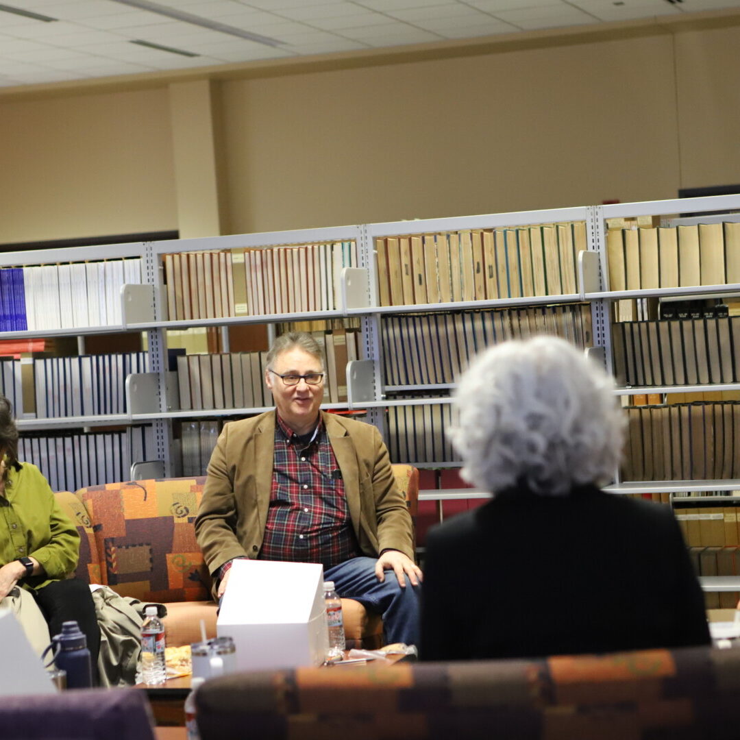 Director of Theater Mark Mannette shares ideas during a meeting with fellow faculty members. 