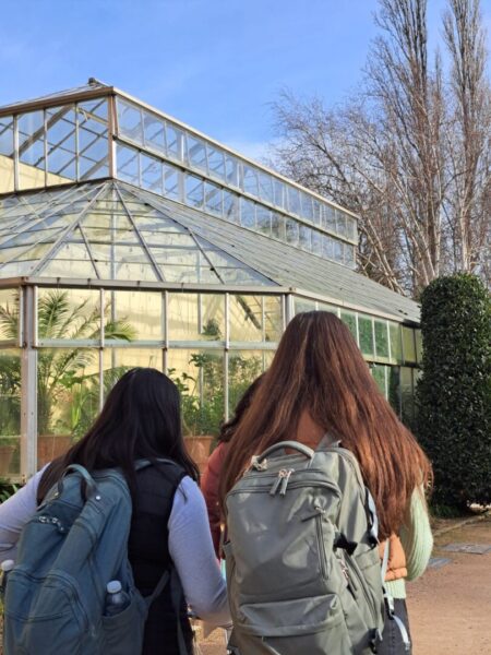 Two women with backpacks stand out side the Botanical Gardens in Oxford.