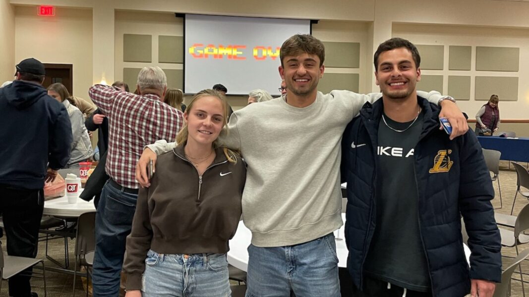Three Newman University students took first place and won the $300 gift card prize pack during Trivia Night.