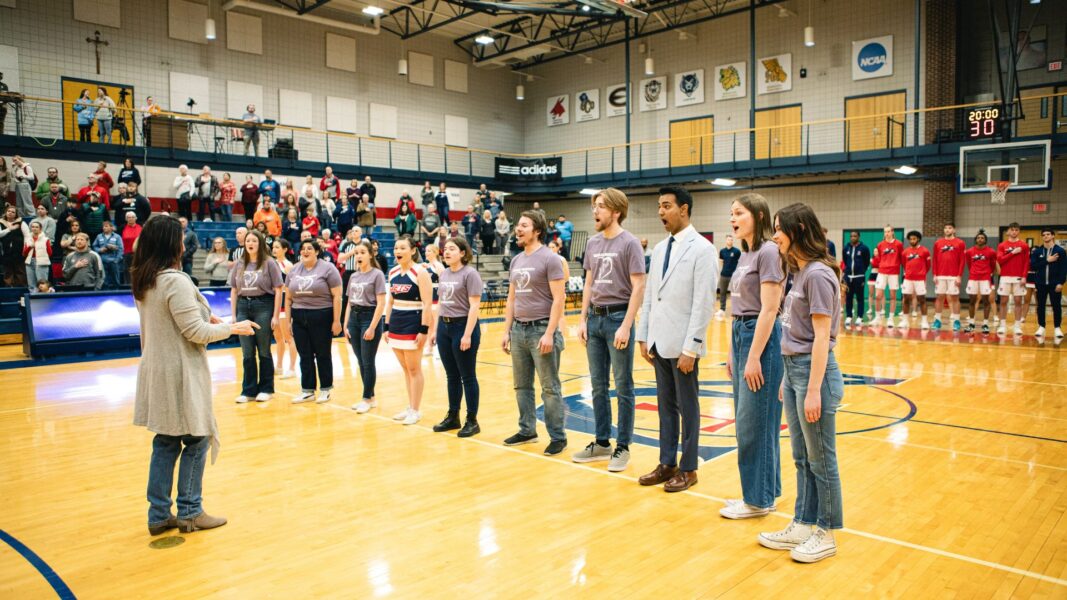 The Newman chorale performed the National Anthem during homecoming.