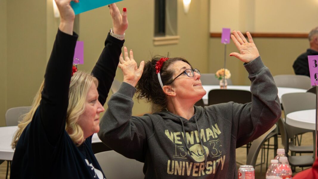 More than 120 people gathered to participate in Giving Day's Pop Culture Through the Decades Trivia Night at Newman University.