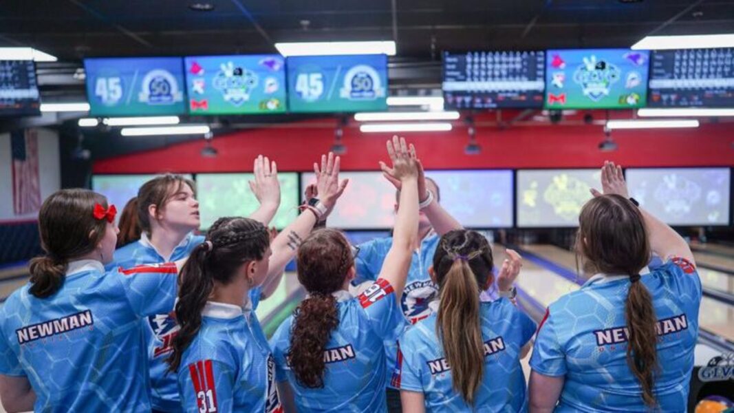Newman Jets Athletics bowling women give high fives after achieving runners up status at the GLVC Championships.