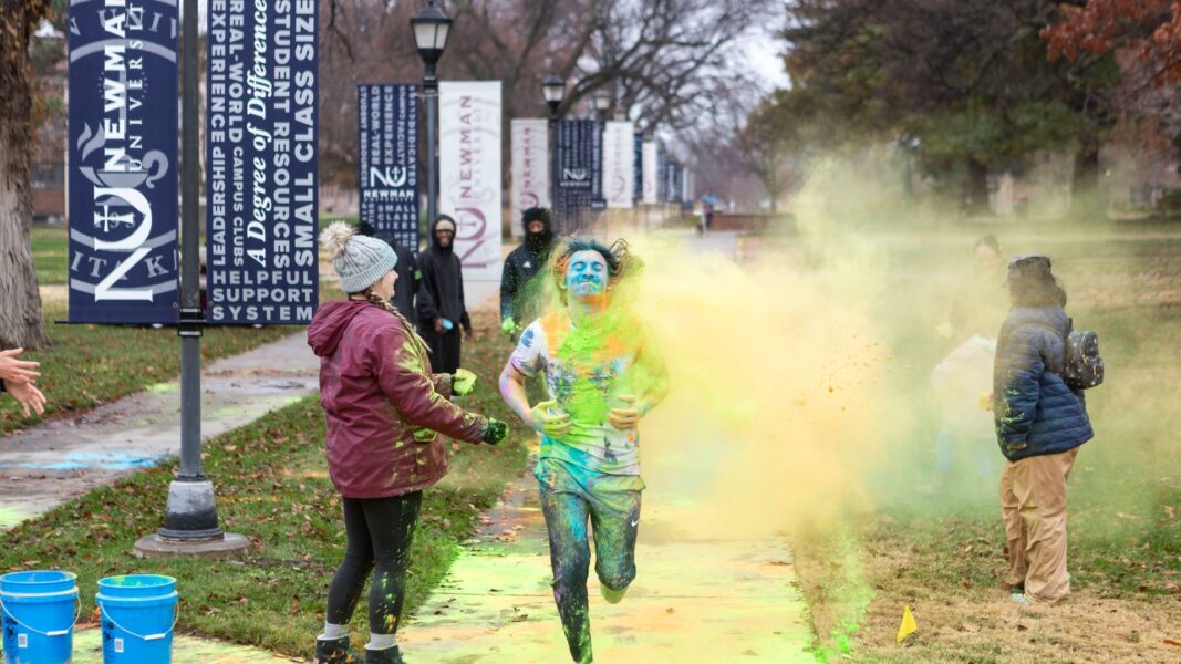 Students, staff and alumni participate in the Color Run with colorful powder on campus Dec. 2.