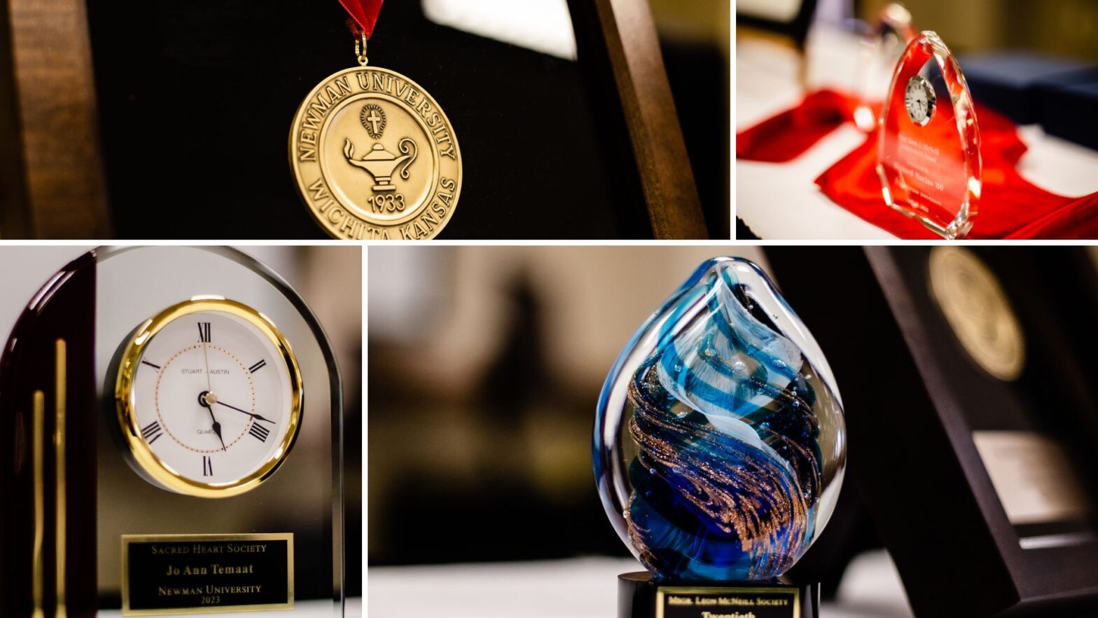 Four Newman Legacy Awards in the form of the St. Newman Medal, two clocks set in a crystal glass award and a blue glass swirled award.